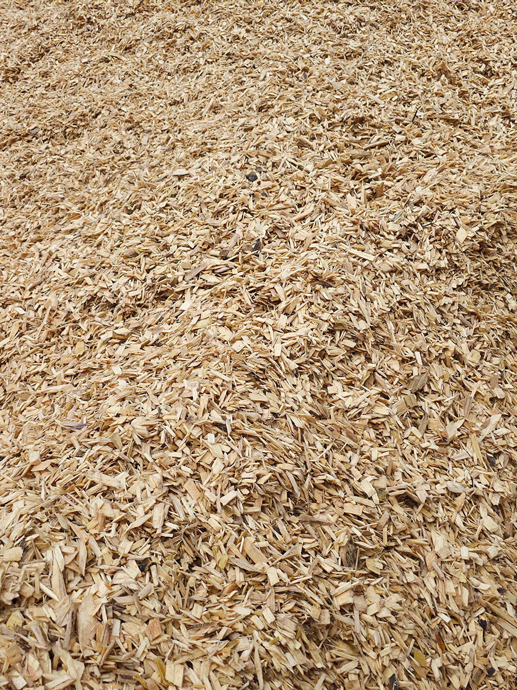 Pile of hardwood chips produced at Turman Forest Products sawmill in Virginia, repurposed for mulch, pellets, and sustainable byproduct markets.