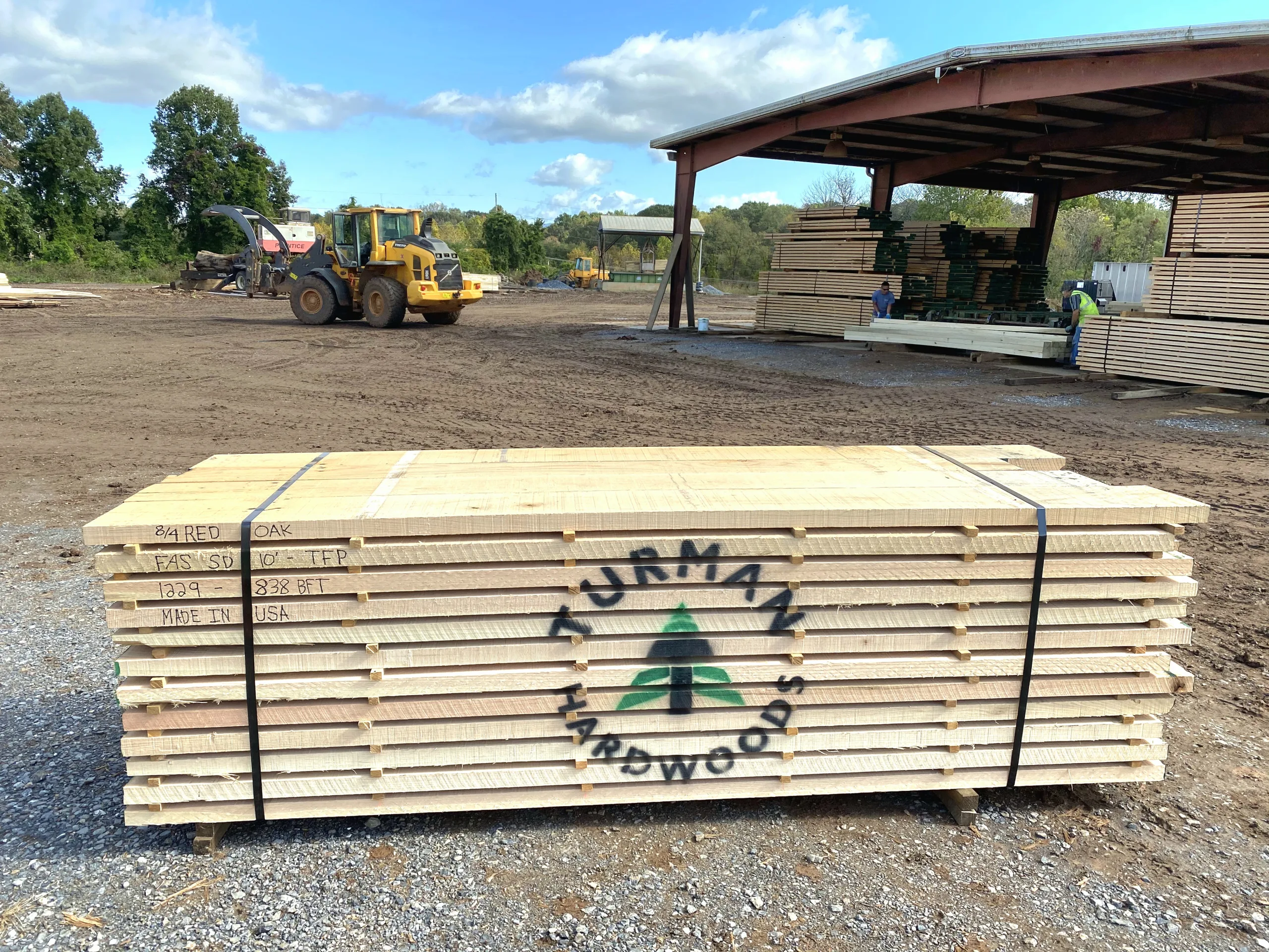 A bundle of export ready shipping dry red oak hardwood lumber from Turman Forest Products, stenciled with the "Turman Hardwood" logo and stacked at their Appalachian sawmill in Bedford, Virginia.