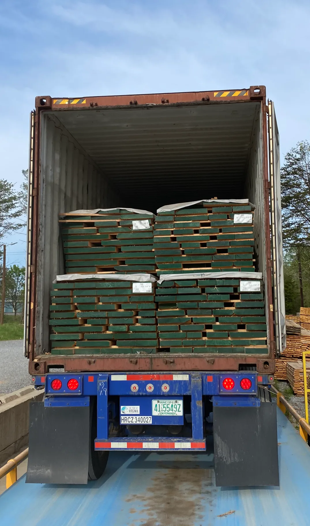 Container truck being loaded with ship dry Appalachian hardwood lumber at Turman Forest Products export facility in Virginia.
